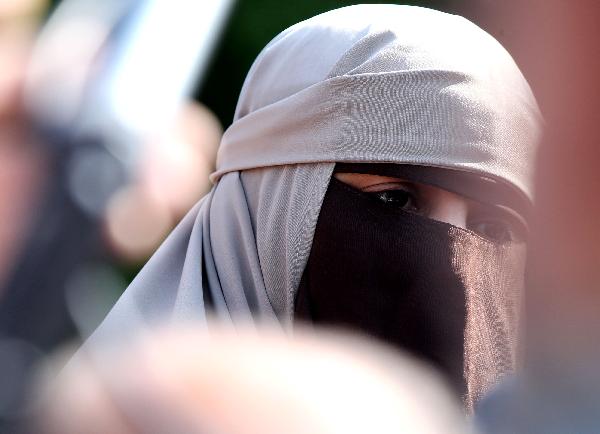 Muslim women protest against full-face veil ban in Paris, France
