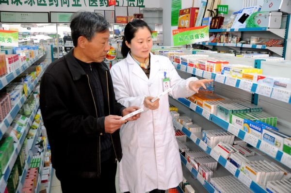 China's health reform cuts drug prices, but still fights pain 