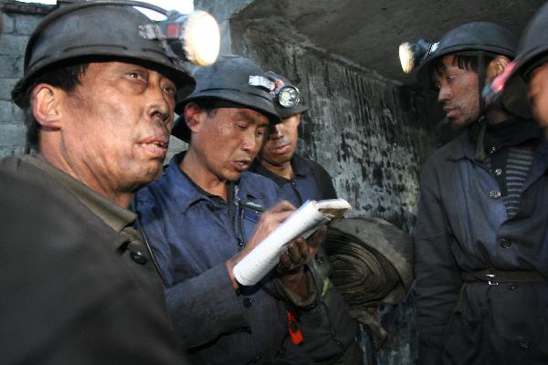Rescuers striving to retrieve flood-trapped coal miners in SW China