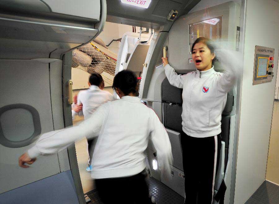 Students receive simulative training for Airbus A320 at the Cabin Attendant College of Civil Aviation University of China in north China's Tianjin, Nov. 2, 2012. (Xinhua/You Sixing)
