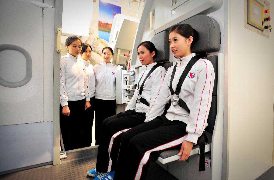 Students receive simulative training for Airbus A320 at the Cabin Attendant College of Civil Aviation University of China in north China's Tianjin, Nov. 2, 2012. (Xinhua/You Sixing)