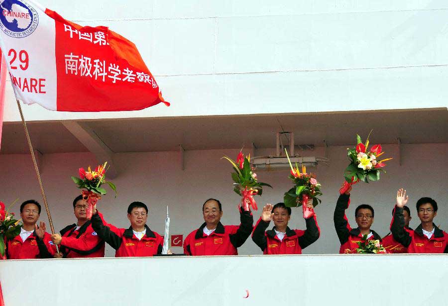 Members of the Chinese National Antarctic Research Expedition wave hands after boarding the icebreaker Xuelong in Guangzhou City, capital of south China's Guangdong Province, Nov. 5, 2012. Chinese research vessel and icebreaker Xuelong, or "Snow Dragon," left Guangzhou on Monday for the country's 29th scientific expedition to Antarctica. (Xinhua/Huang Guobao) 
