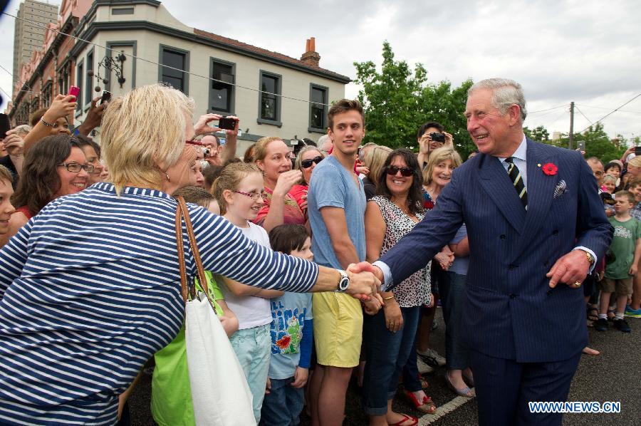 Britain's Prince Charles (R) shakes hands with residents in Melbourne, Australia, Nov. 6, 2012. Prince Charles and his wife Camilla are on a six-day Australian tour to mark the Queen's Diamond Jubilee. (Xinhua/Bai Xue) 