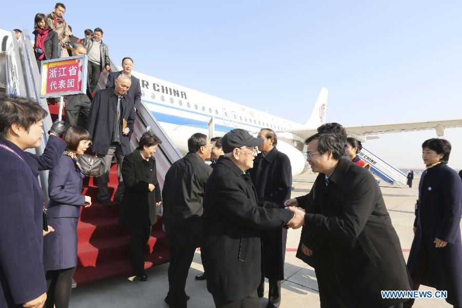 Delegates of the 18th National Congress of the Communist Party of China (CPC) from east China's Zhejiang Province, arrive in Beijing, capital of China, Nov. 6, 2012. The 18th CPC National Congress will be opened in Beijing on Nov. 8. (Xinhua/Ding Lin)