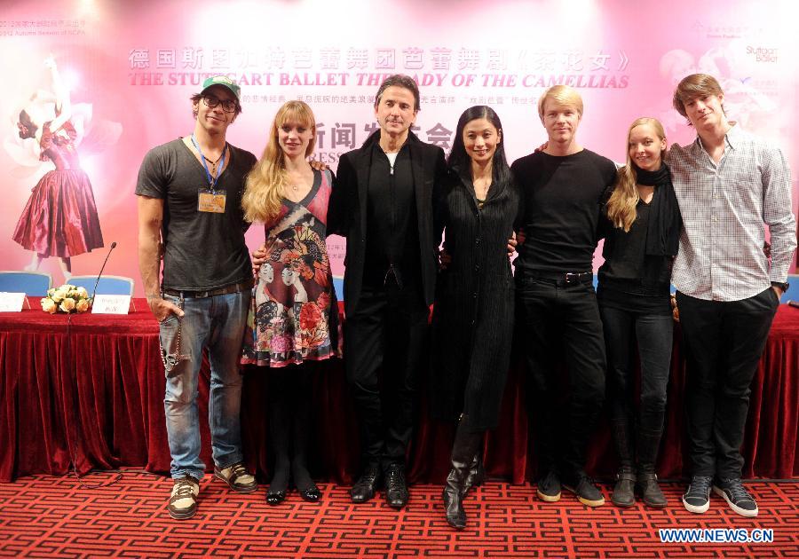 Cast members of the stage drama "The Lady of The Camallias" pose for pictures during a press conference of the drama in Beijing, capital of China, Nov. 6, 2012. (Xinhua/Luo Xiaoguang)