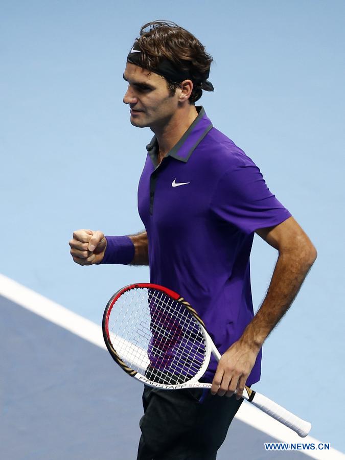 Roger Federer of Switzerland jubilates after the men's singles Group B tennis match against Janko Tipsarevic of Serbia at the ATP World Tour Finals at the O2 Arena in London, Britain, on Nov. 6, 2012. Roger Federer won 2-0. (Xinhua/Wang Lili) 