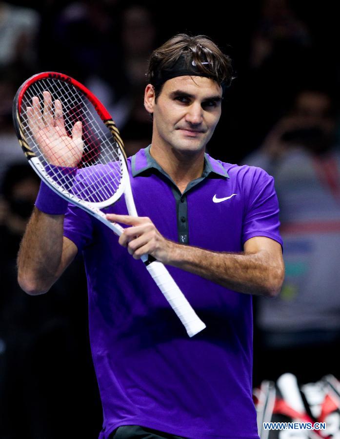 Roger Federer of Switzerland celebrates after the men's singles Group B tennis match against Janko Tipsarevic of Serbia at the ATP World Tour Finals at the O2 Arena in London, Britain, on Nov. 6, 2012. Roger Federer won 2-0. (Xinhua/Tang Shi)