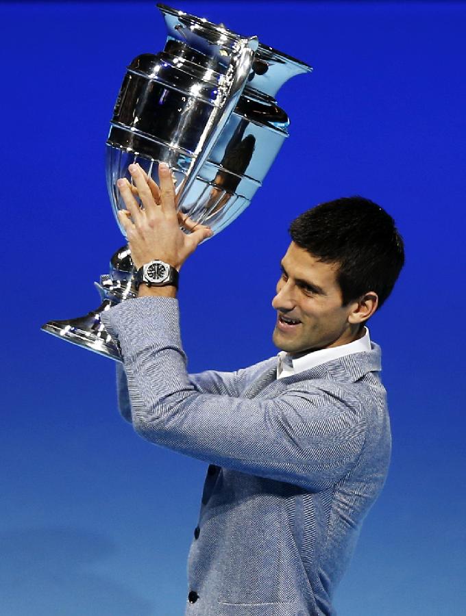 Novak Djokovic of Serbia holds the trophy of the 2012 ATP World Tour No. 1 Award at the O2 Arena in London, Britain, on Nov. 6, 2012. Djokovic was presented the 2012 ATP World Tour No. 1 Award and the Arthur Ashe Humanitarian Award in London Tuesday. (Xinhua/Wang Lili)