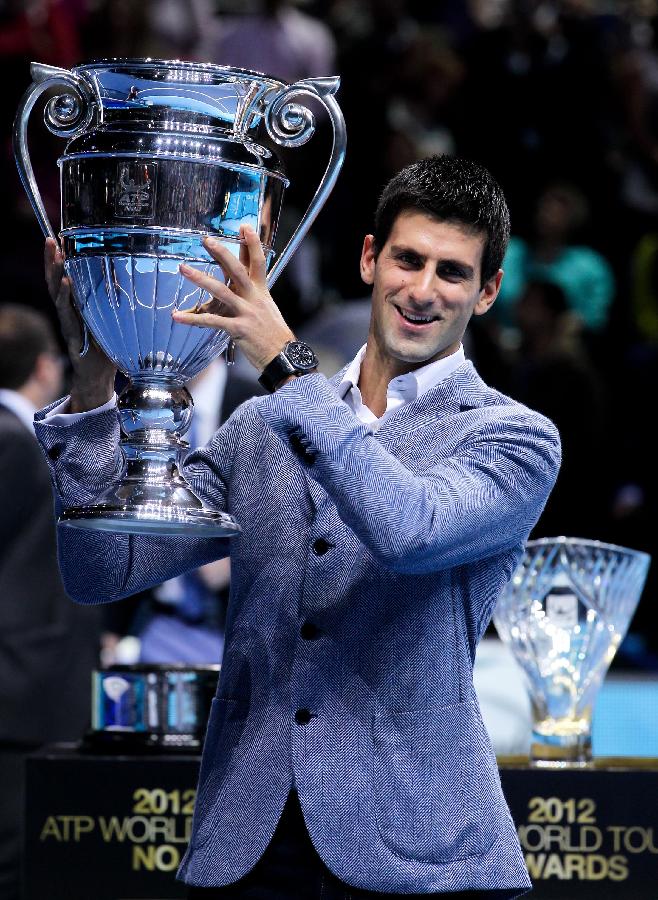 Novak Djokovic of Serbia holds the trophy of the 2012 ATP World Tour No. 1 Award at the O2 Arena in London, Britain, on Nov. 6, 2012. Djokovic was presented the 2012 ATP World Tour No. 1 Award and the Arthur Ashe Humanitarian Award in London Tuesday. (Xinhua/Tang Shi) 