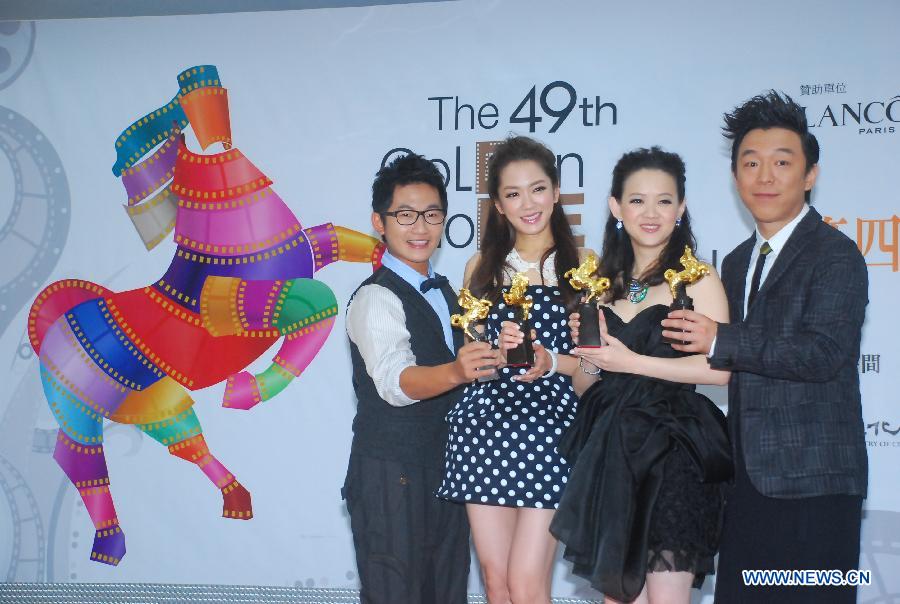 Hosts of the 49th Golden Horse Awards ceremony Huang Bo, Bowie Tsang, Pink Yang and Chang-Hsien Tsai (From R to L) pose for photos at a press conference in Taipei, southeast China's Taiwan, Nov. 7, 2012. (Xinhua)