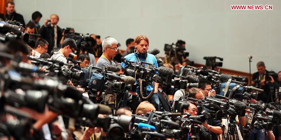 Reporters work during the opening ceremony of the 18th National Congress of the Communist Party of China (CPC) at the Great Hall of the People in Beijing, capital of China, Nov. 8, 2012. The 18th CPC National Congress opened in Beijing on Thursday. (Xinhua/Li Tao)