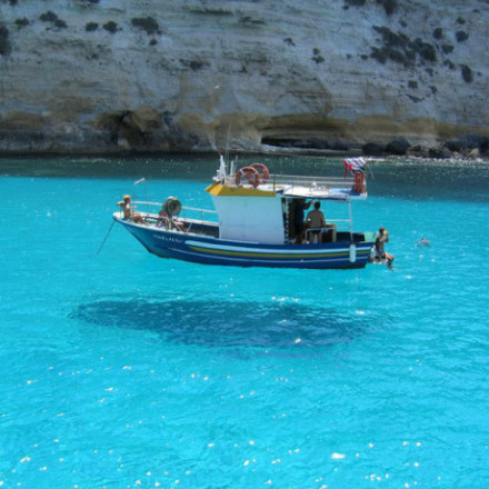Pelagie Islands are the three small islands of Lampedusa, Linosa, and Lampione, located in the Mediterranean Sea between Malta and Tunisia, south of Sicily. 