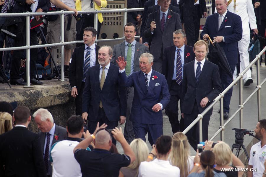 Britain's Prince Charles (C front) meets crowds at the Bondi Beach in Sydney, Australia, Nov. 9, 2012. Britain's Prince Charles and his wife Camilla have arrived in Sydney, enjoying a barge ride on the Sydney harbor before a morning tea with Australian Defense Force personnel and their families, local media reported on Friday. (Xinhua/Jin Linpeng)