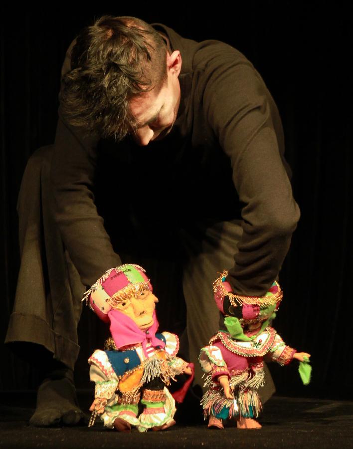 A British puppeteer performs during the third Shanghai International Puppet Festival in east China's Shanghai, Nov. 9, 2012. The puppet festival, which opened here on Friday, is part of the 14th Shanghai International Arts Festival. The event attracted 11 foreign puppet theatres. (Xinhua/Ding Ting) 