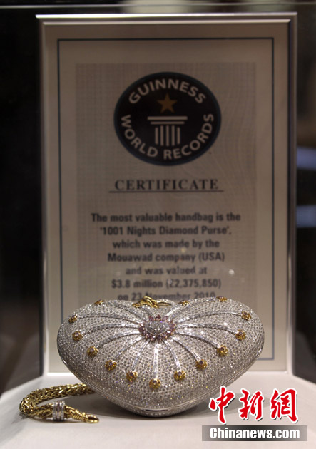 "The Mouawad 1001 Nights Diamond Purse" is seen on display in Doha, Feb 20,2011. The handbag incorporates 18 kt gold, 4,517 diamonds, weighs 381.92 carats and is valued at $3.8 million - setting the world record for the most expensive handbag, according the Guinness World Records. (Photo/Chinanews.com)