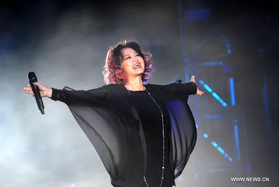 Singer Delphine Chan sings at Rock Records 30th Anniversary Nanjing Concert in Nanjing, capital of east China's Jiangsu Province, Nov. 10, 2012. More than 50 singers performed at the concert. (Xinhua/Wang Yuewu)  