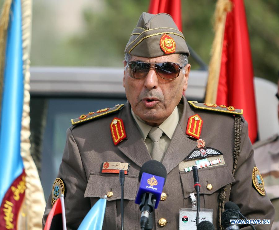 Libyan Chief of Staff of the Air Defense Forces, Brigadier Jomaa al-Abani delivers a speech during the dismantling of war remnants, in Tripoli, Nov. 11, 2012. Experts were assigned to dump the toxic chemicals found in the air defense missiles and ammunition left over from the former Libyan leader Moamer Kadhafi's regime, under the supervision of the United Nations. (Xinhua/Hamza Turkia) 