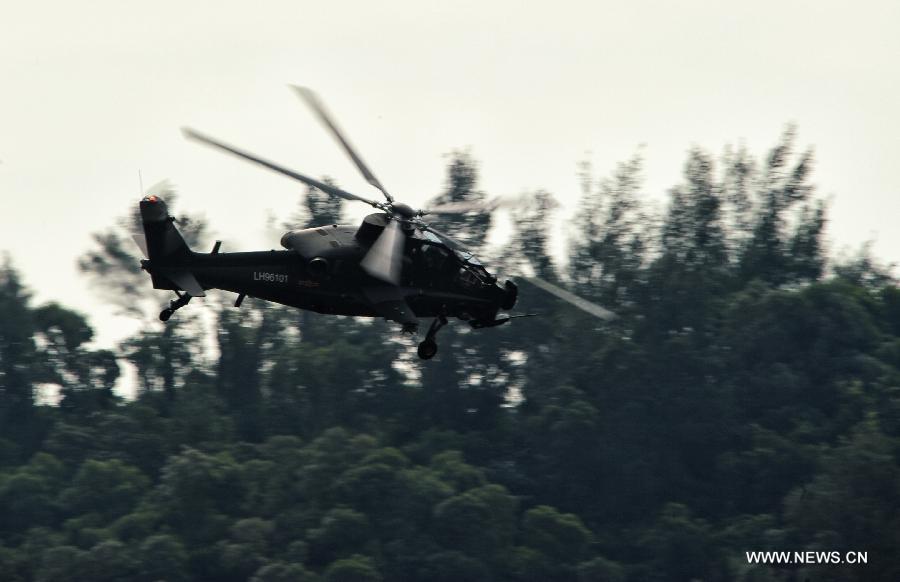 A WZ-10 attack helicopter flies past during a training in Zhuhai, south China's Guangdong Province, Nov. 11, 2012. WZ-10 attack helicopter made its first public appearence before the 9th China International Aviation and Aerospace Exhibition, which will kick off on Tuesday in Zhuhai. (Xinhua/Yang Guang) 