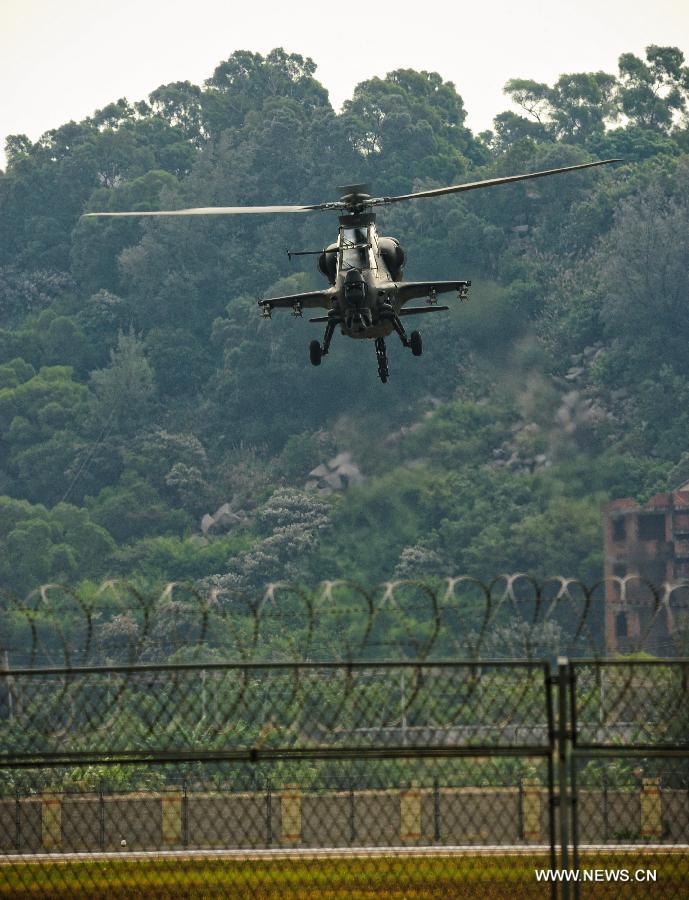 A WZ-10 attack helicopter flies past during a training in Zhuhai, south China's Guangdong Province, Nov. 11, 2012. WZ-10 attack helicopter made its first public appearence before the 9th China International Aviation and Aerospace Exhibition, which will kick off on Tuesday in Zhuhai. (Xinhua/Yang Guang) 