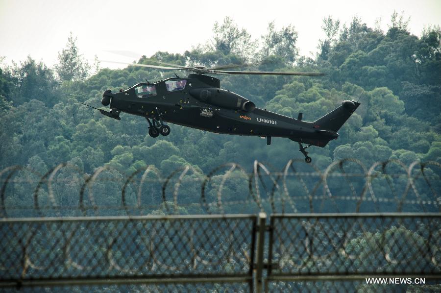 A WZ-10 attack helicopter flies past during a training in Zhuhai, south China's Guangdong Province, Nov. 11, 2012. WZ-10 attack helicopter made its first public appearence before the 9th China International Aviation and Aerospace Exhibition, which will kick off on Tuesday in Zhuhai. (Xinhua/Yang Guang) 