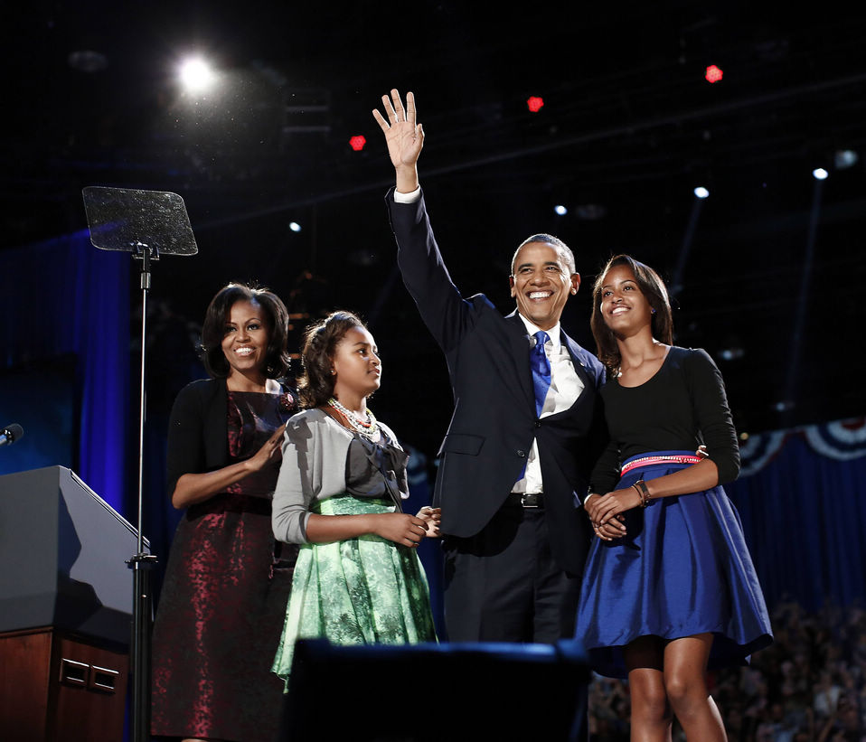 U.S. President Barack Obama and his family wave to his supporters at the election night rally in Chicago on Nov. 6, 2012. Barack Obama won re-election after a tight race with Republican rival Mitt Romney. (Xinhua/Reuter)