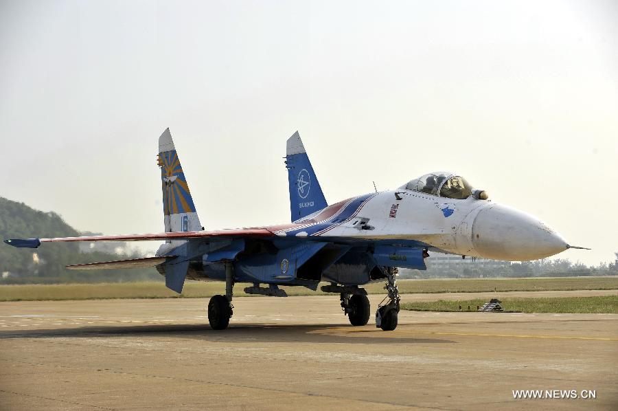 A Su-27 fighter jet of Russian aerobatic tam "Russian Knights" taxis on the runway after a test flight in Zhuhai, south China's Guangdong Province, Nov. 12, 2012. The 9th China International Aviation and Aerospace Exhibition will kick off on Tuesday in Zhuhai. (Xinhua/Liang Xu)