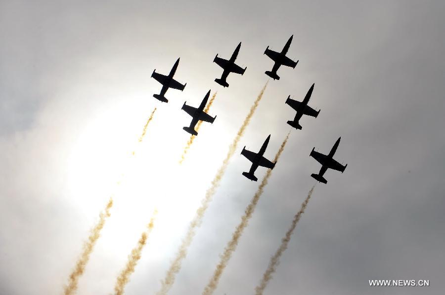 Jets of Breitling Jet Team, the largest civilian aerobatic team in Europe, perform a test flight in Zhuhai, south China's Guangdong Province, Nov. 12, 2012. The 9th China International Aviation and Aerospace Exhibition will kick off on Tuesday in Zhuhai. (Xinhua/Liang Xu)