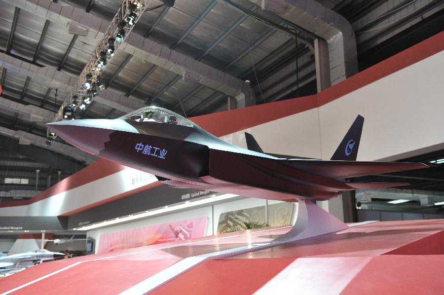 Photo taken on Nov. 12, 2012 shows a conceptual fighter model made by the Aviation Industry Corporation of China (AVIC), in Zhuhai, south China's Guangdong Province. The 9th China International Aviation and Aerospace Exhibition kicked off on Tuesday in Zhuhai. As a major exhibitor, AVIC will showcase over 150 products during the 6-day-long airshow. (Xinhua/Yang Guang)