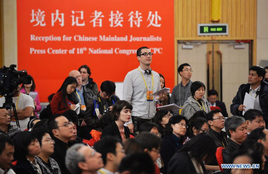 Journalists are seen at a press conference held by the press center of the 18th National Congress of the Communist Party of China (CPC) in Beijing, capital of China, Nov. 12, 2012. (Xinhua/Li Xin)