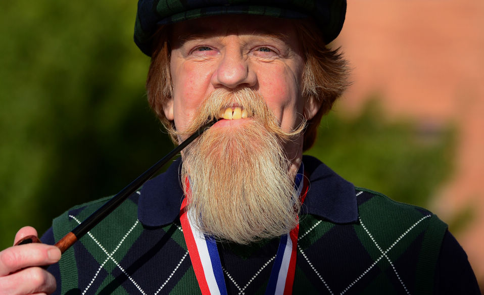 A contestant poses after winning first place in the Freestyle Moustache category at the third annual National Beard and Moustache Championships in Las Vegas, Nevada on November 11, 2012. (Xinhua/AFP)