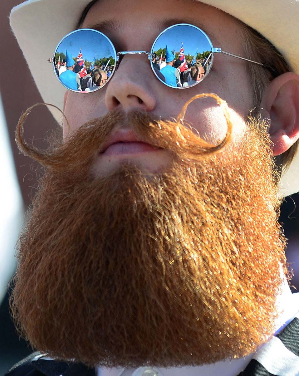 A contestant poses after winning first place in the Freestyle Moustache category at the third annual National Beard and Moustache Championships in Las Vegas, Nevada on November 11, 2012. (Xinhua/AFP)