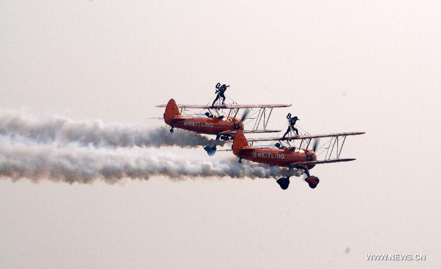 Members of Breitling Wingwalkers, a famous European aerobatic team, perform during the 9th China International Aviation and Aerospace Exhibition in Zhuhai, south China's Guangdong Province, Nov. 13, 2012. (Xinhua/Zhang Chaoxiang) 