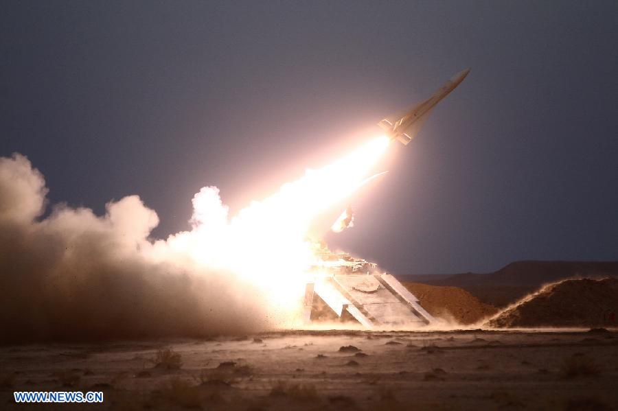 An Iranian surface-to-air missile is launched during military maneuvers at an undisclosed location in Iran on Nov. 13, 2012. (Xinhua)