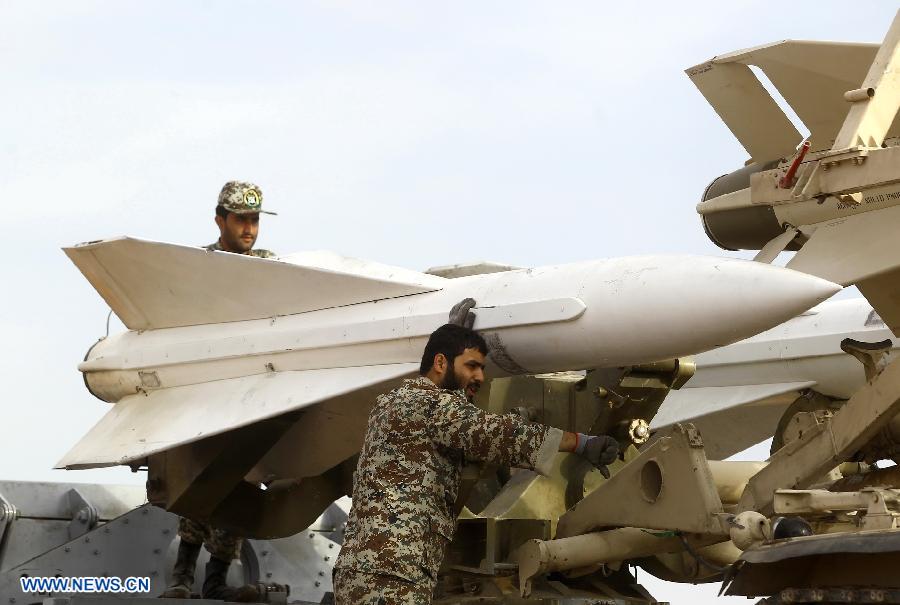 Iranian army personnel prepare to launch a Hawk surface-to-air missile during military maneuvers at an undisclosed location in Iran on Nov. 13, 2012. (Xinhua)