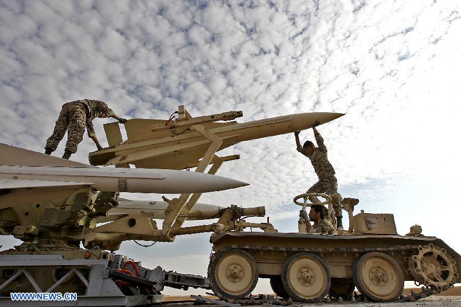 Iranian army personnel prepare to launch a Hawk surface-to-air missile during military maneuvers at an undisclosed location in Iran on Nov. 13, 2012. (Xinhua)