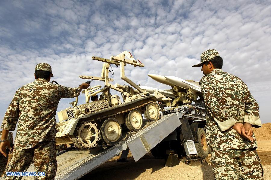 Iranian army personnel prepare to launch a Hawk surface-to-air missile during military maneuvers at an undisclosed location in Iran on Nov. 13, 2012. (Xinhua)