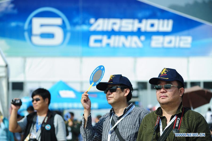 Visitors are seen during the 9th China International Aviation and Aerospace Exhibition in Zhuhai, south China's Guangdong Province, Nov. 13, 2012. Some 650 manufactures at home and abroad attended the six-day airshow kicked off on Tuesday, which was expected to receive 400,000 visitors. (Xinhua/Yang Guang)