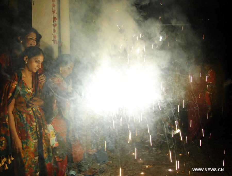 Pakistani Hindus play with fireworks to celebrate the Hindu festival of Diwali, in eastern Pakistan's Lahore, on Nov. 13, 2012. People light lamps and offer prayers to the goddess of wealth Lakshmi in the Hindu festival of Diwali, the festival of lights, which falls on Nov. 13 this year. (Xinhua/Sajjad)