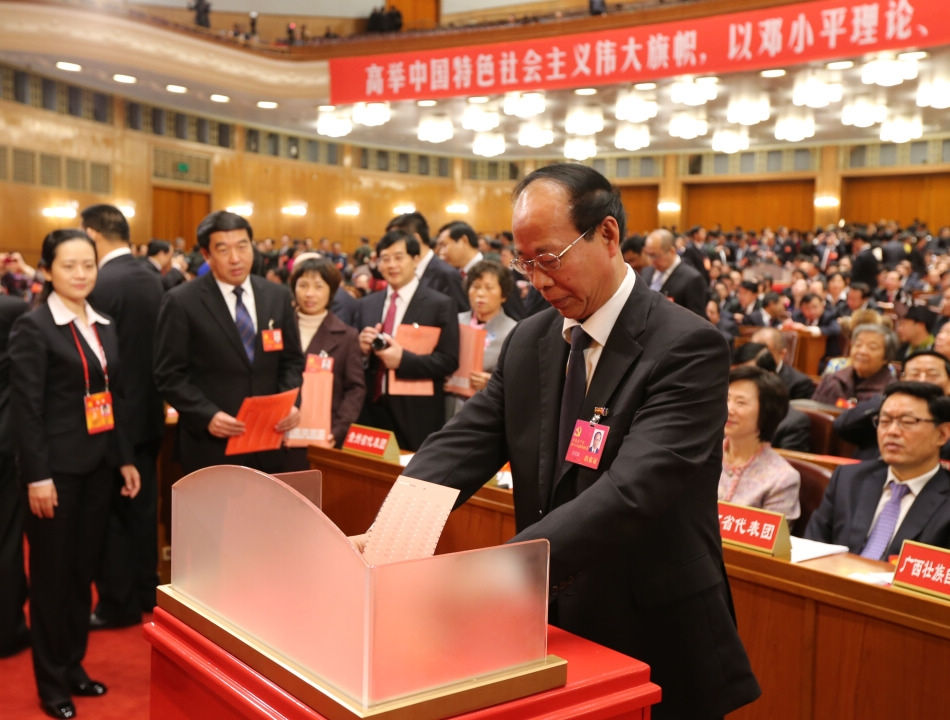 A delegate casts his ballot during the closing session of the 18th National Congress of the Communist Party of China (CPC) at the Great Hall of the People in Beijing, capital of China, Nov. 14, 2012. The congress started its closing session here Wednesday morning, at which a new CPC Central Committee and a new Central Commission for Discipline Inspection will be elected. (Xinhua/Yao Dawei)