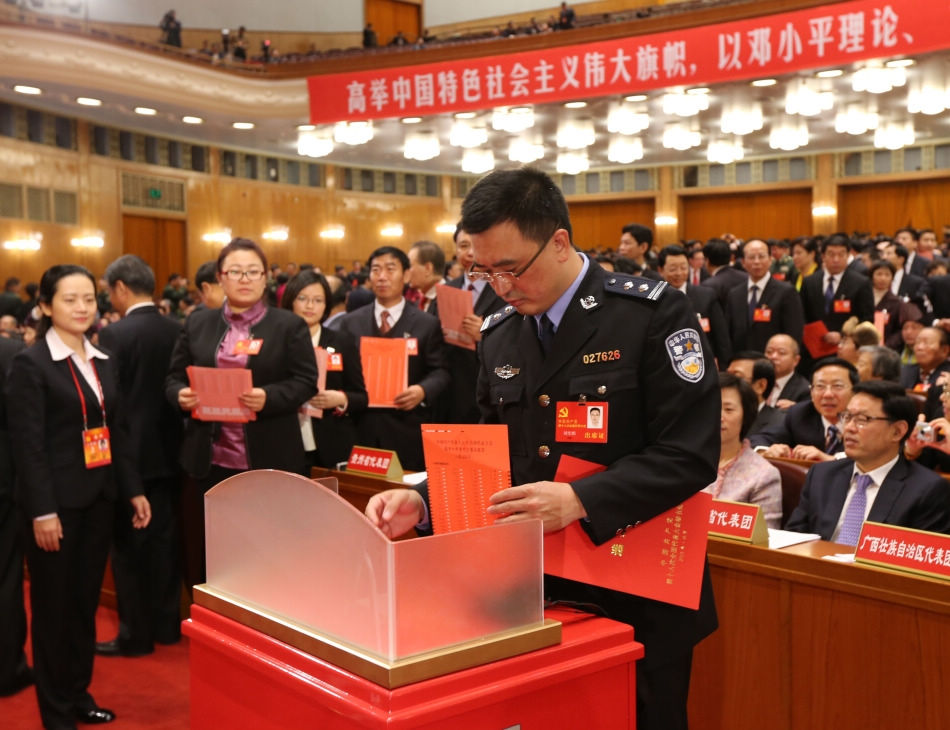 A delegate casts his ballot during the closing session of the 18th National Congress of the Communist Party of China (CPC) at the Great Hall of the People in Beijing, capital of China, Nov. 14, 2012. The congress started its closing session here Wednesday morning, at which a new CPC Central Committee and a new Central Commission for Discipline Inspection will be elected. (Xinhua/Yao Dawei)