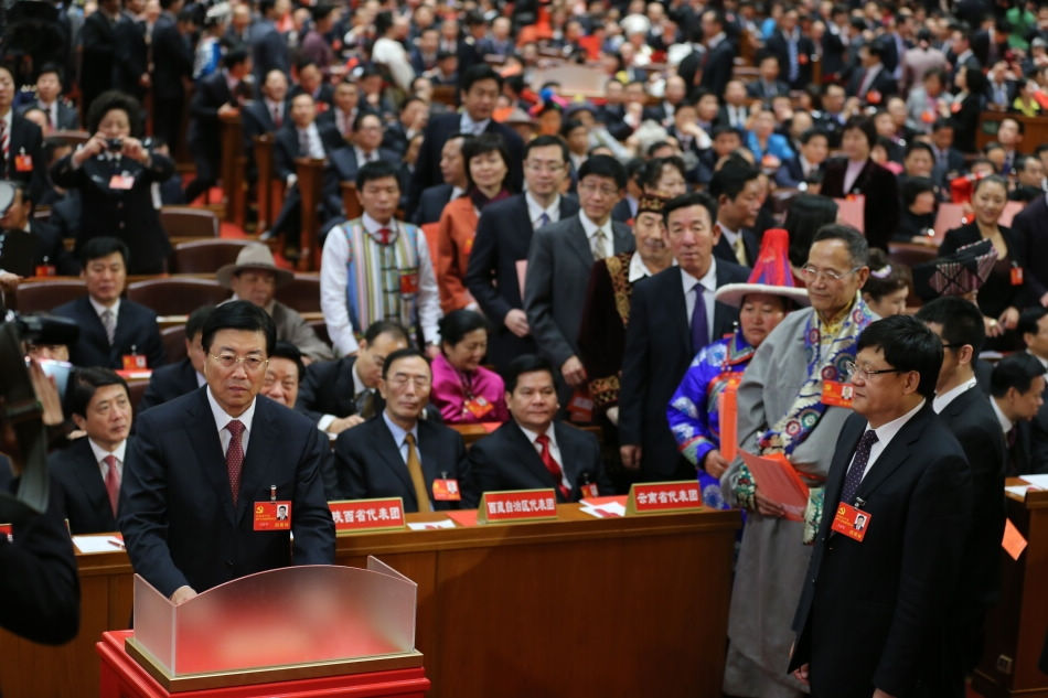 A delegate casts his ballot during the closing session of the 18th National Congress of the Communist Party of China (CPC) at the Great Hall of the People in Beijing, capital of China, Nov. 14, 2012. The congress started its closing session here Wednesday morning, at which a new CPC Central Committee and a new Central Commission for Discipline Inspection will be elected. (Xinhua/Yao Dawei)