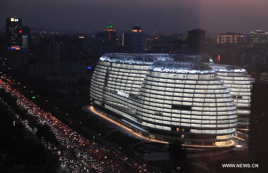 Photo taken on Nov. 14, 2012 shows the exterior of Galaxy Soho building in Beijing, capital of China. The newly-built building, desigened by Iraqi-British architect Zaha Hadid, is a 330,000-square-meter office, retail and entertainment complex. (Xinhua/Hu Qingming) 