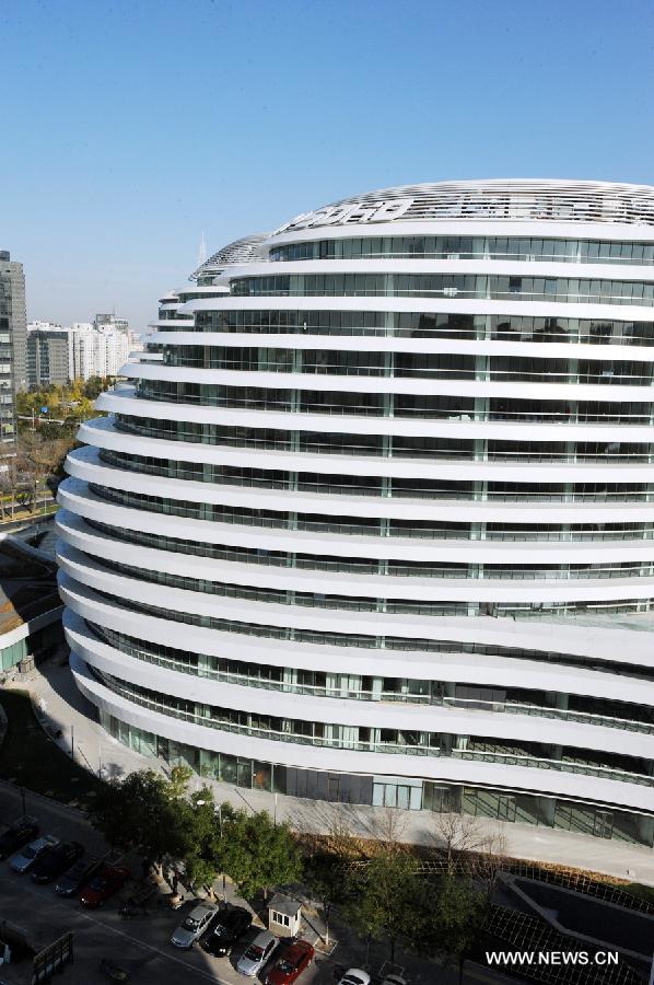 Photo taken on Nov. 14, 2012 shows the exterior of Galaxy Soho building in Beijing, capital of China. The newly-built building, desigened by Iraqi-British architect Zaha Hadid, is a 330,000-square-meter office, retail and entertainment complex. (Xinhua/Hu Qingming) 