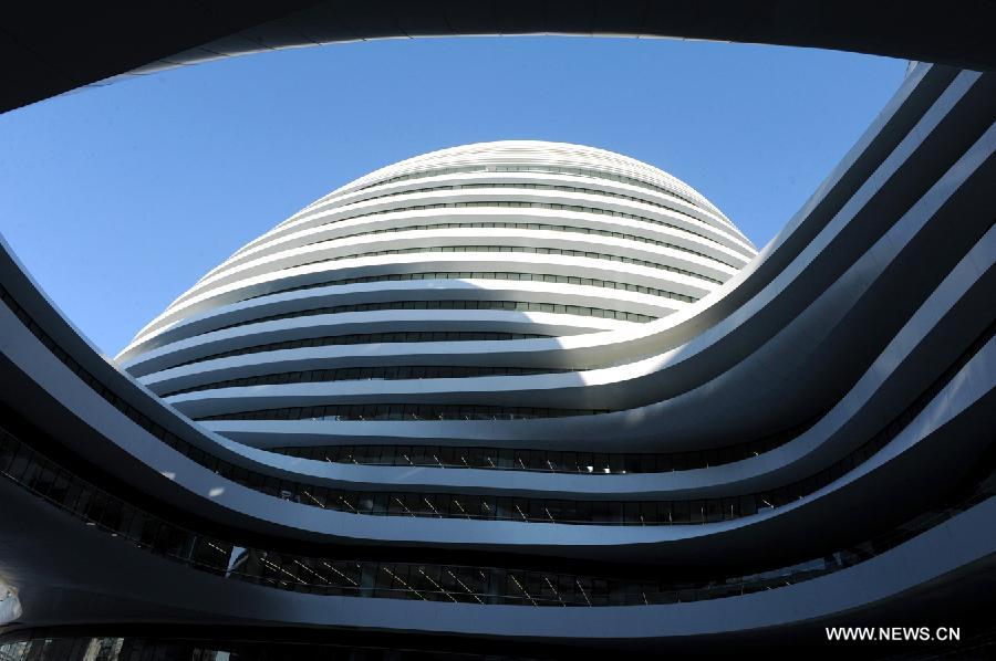 Photo taken on Nov. 14, 2012 shows the exterior of Galaxy Soho building in Beijing, capital of China. The newly-built building, desigened by Iraqi-British architect Zaha Hadid, is a 330,000-square-meter office, retail and entertainment complex. (Xinhua/Hu Qingming) 