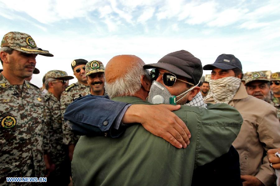 Iranian army members celebrate after successfully launching a surface-to-air missile during a military drill at an undisclosed location in Iran, on Nov. 14, 2012. Iran's Army and the Islamic Revolution Guards Corps have test-fired a range of missiles and unveiled their military achievements in the ongoing joint air defense drill starting on Monday. (Xinhua/Majid Asgaripour)