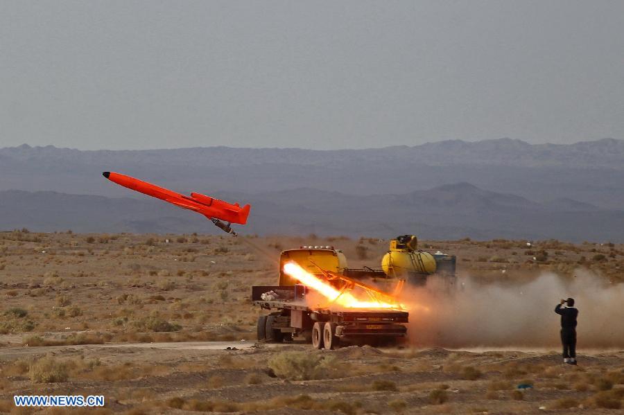 An Iranian surface-to-air missile is launched during a military drill at an undisclosed location in Iran, on Nov. 14, 2012. Iran's Army and the Islamic Revolution Guards Corps have test-fired a range of missiles and unveiled their military achievements in the ongoing joint air defense drill starting on Monday. (Xinhua/Majid Asgaripour)
