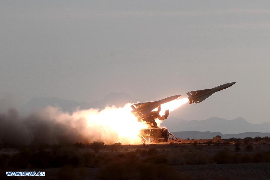 An Iranian surface-to-air missile is launched during a military drill at an undisclosed location in Iran, on Nov. 14, 2012. Iran's Army and the Islamic Revolution Guards Corps have test-fired a range of missiles and unveiled their military achievements in the ongoing joint air defense drill starting on Monday. (Xinhua/Majid Asgaripour)