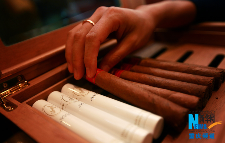 Bie chooses a cigar in Chen Cheng Mansion in Chongqing on Oct. 24, 2012.  