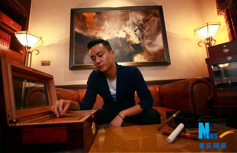 Bie chooses a cigar in Chen Cheng Mansion in Chongqing on Oct. 24, 2012.