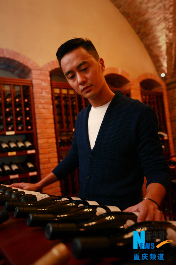 Bie chooses his favorite wine from cellar in Chen Cheng Mansion in Chongqing on Oct. 24, 2012.